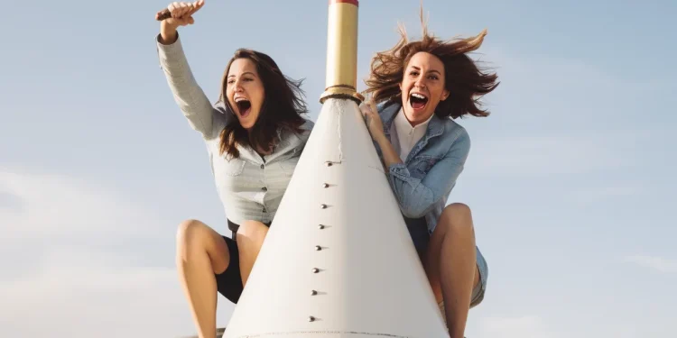 two happy women in a rocket